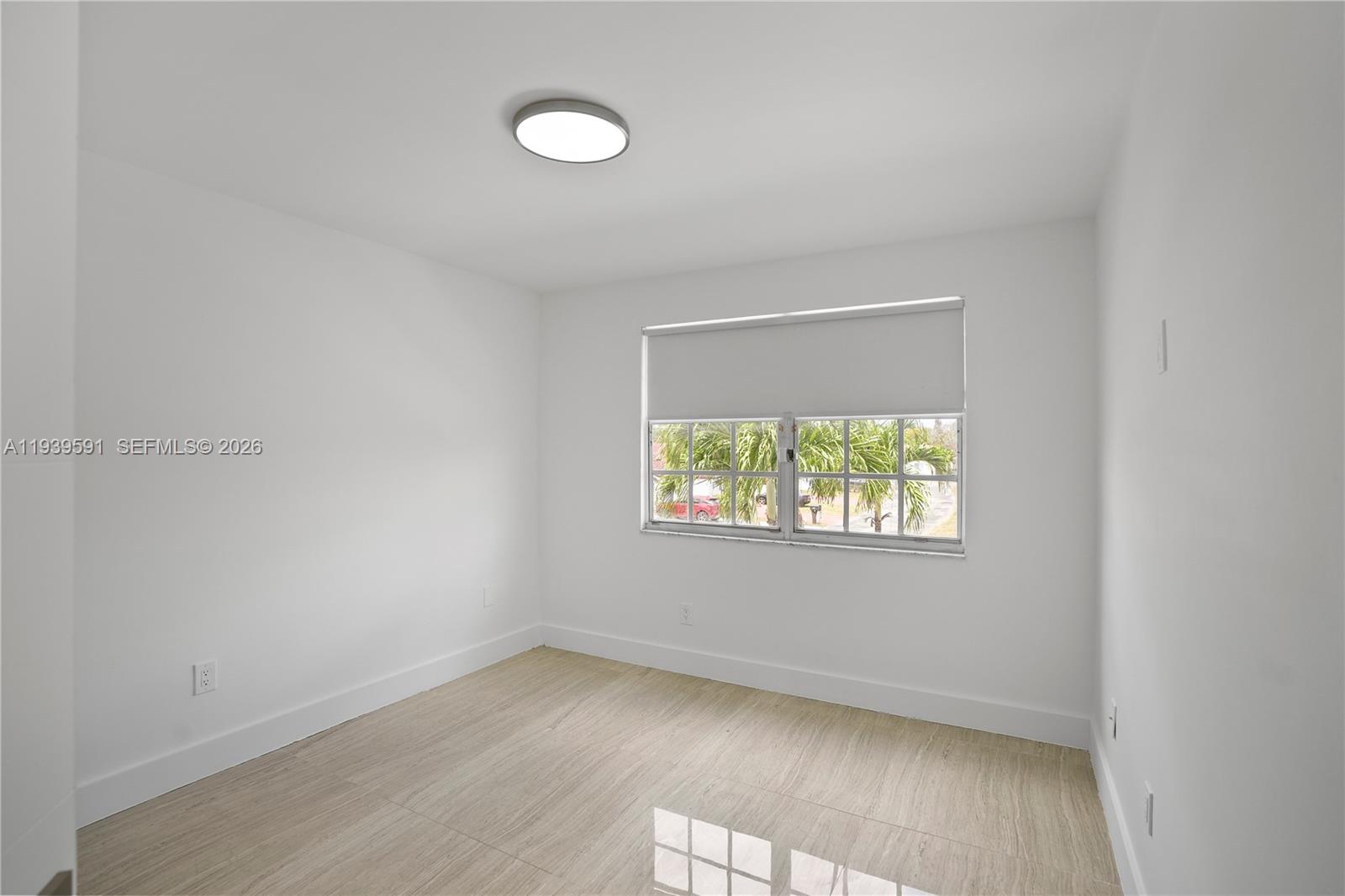 12894 Southwest 60th Terrace Miami, FL 33183 - Photo 24 of 66 an empty room with wooden floor and windows