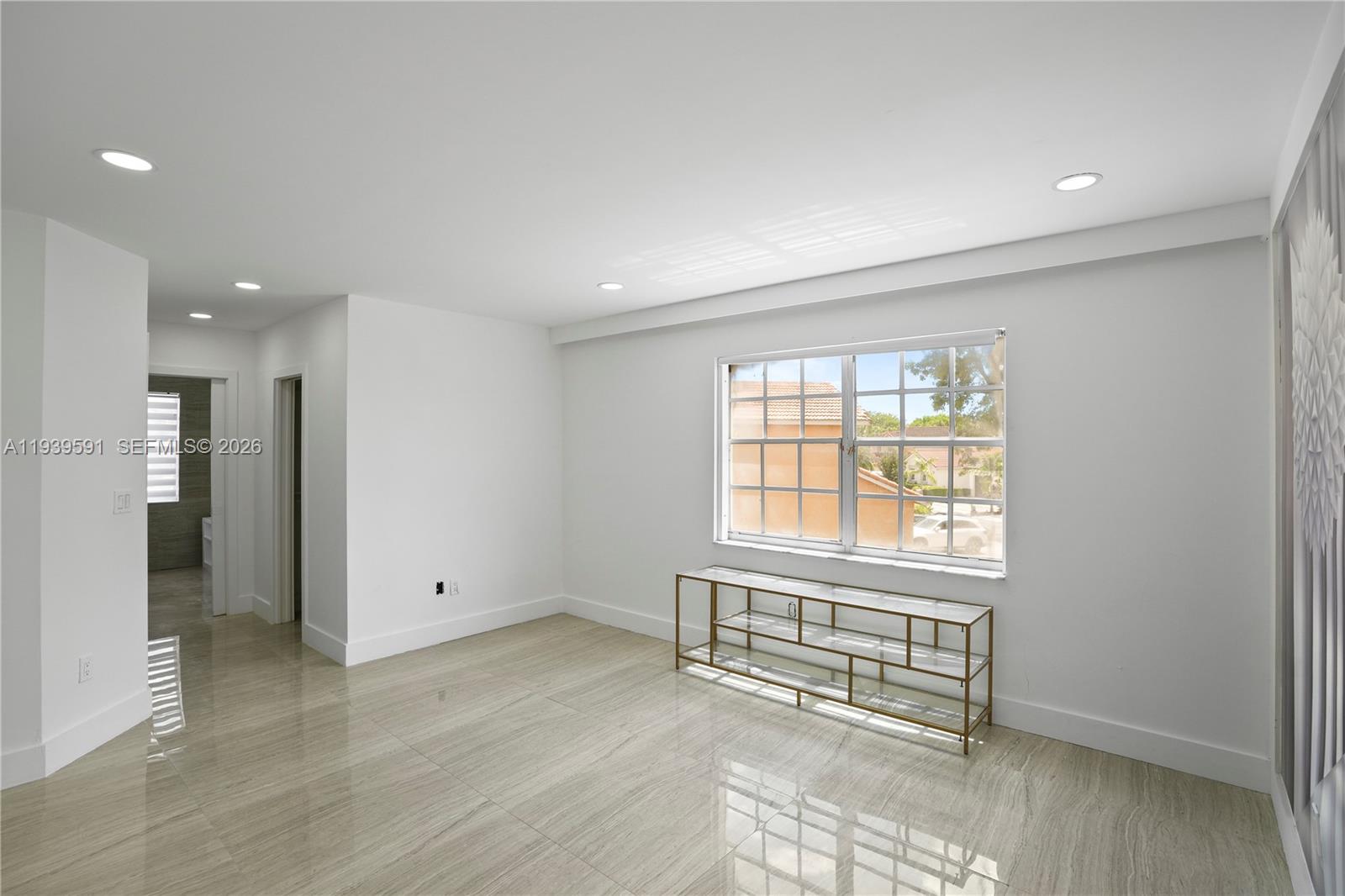 12894 Southwest 60th Terrace Miami, FL 33183 - Photo 37 of 66 a view of an empty room with a window