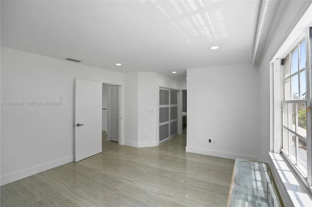 a view of a patio with table and chairs with wooden floor and fence