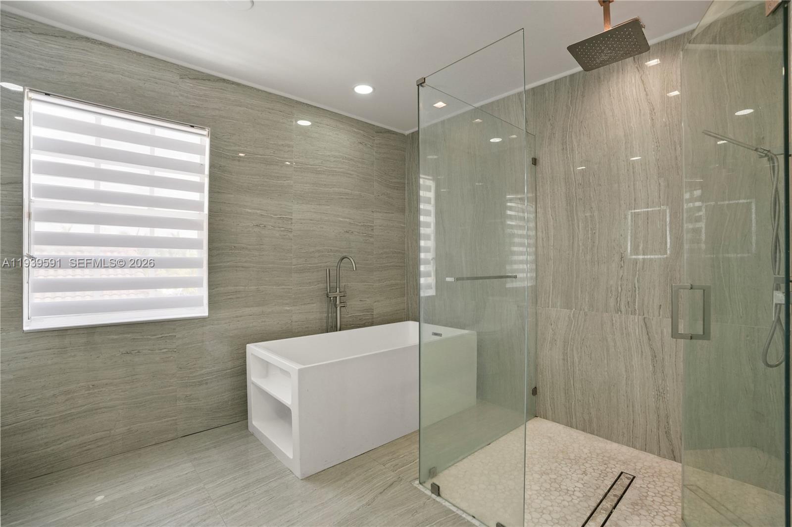 12894 Southwest 60th Terrace Miami, FL 33183 - Photo 43 of 66 a bathroom with a bathtub and shower