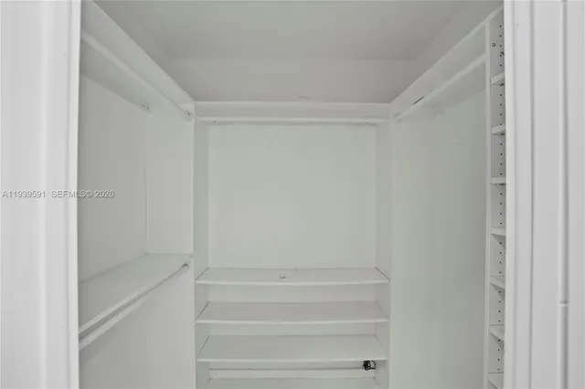 a view of a house with backyard and trees