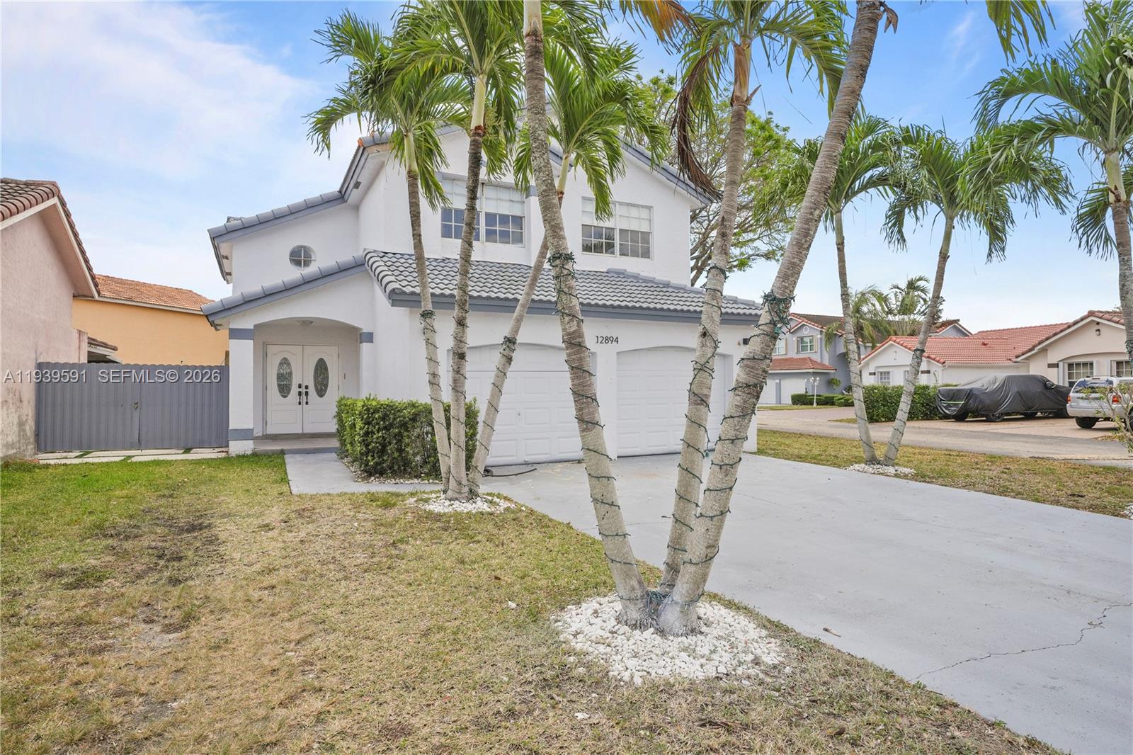 12894 Southwest 60th Terrace Miami, FL 33183 - Photo 57 of 66 a view of a house with backyard and trees