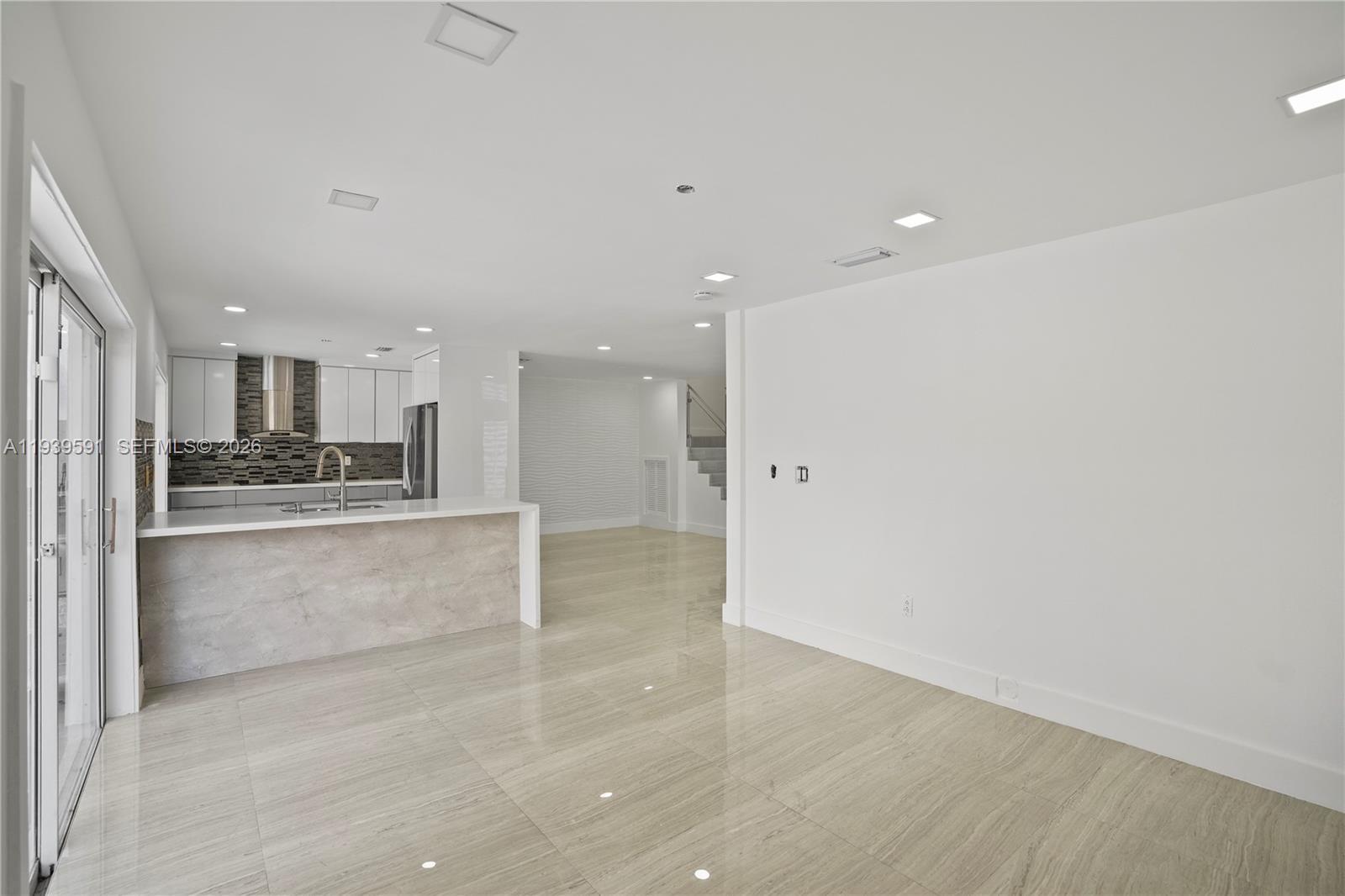 12894 Southwest 60th Terrace Miami, FL 33183 - Photo 9 of 66 a large kitchen with a refrigerator and a stove top oven