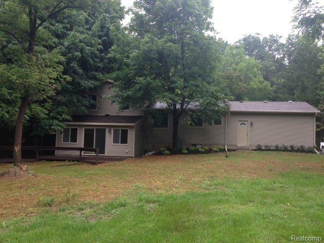 2767 Bullard Road Hartland, MI 48353 - Photo 22 of 22 Yard and deck.jpg