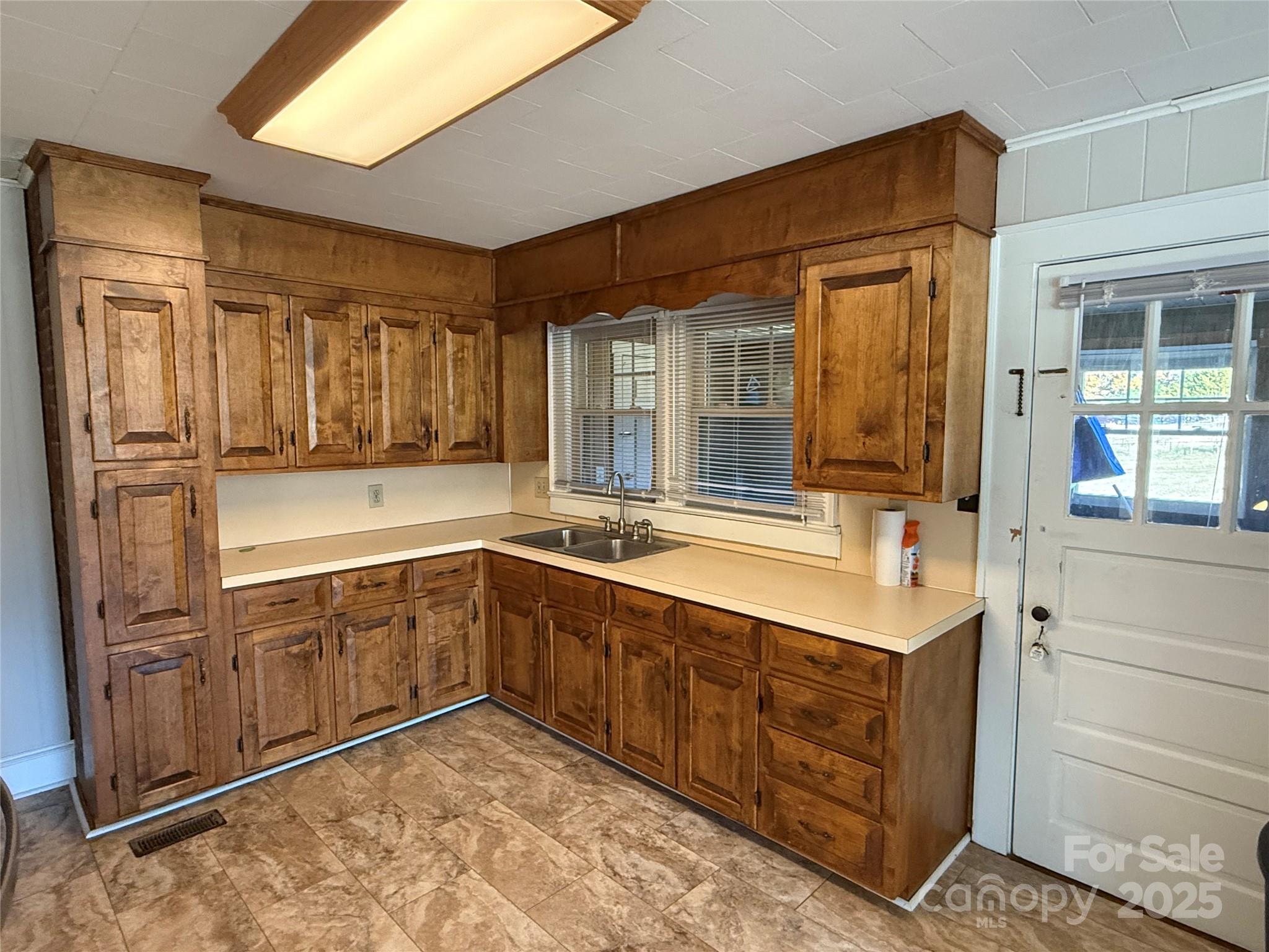2550 Lail Road Glen Alpine, NC 28655 - Photo 11 of 35 a bathroom with a sink and a large mirror