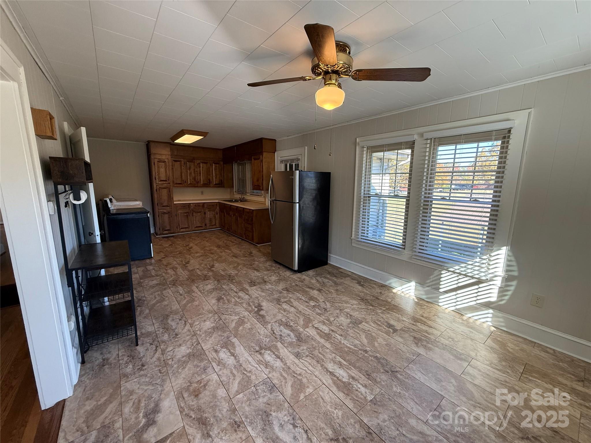 2550 Lail Road Glen Alpine, NC 28655 - Photo 12 of 35 a view of a livingroom with a furniture and a ceiling fan