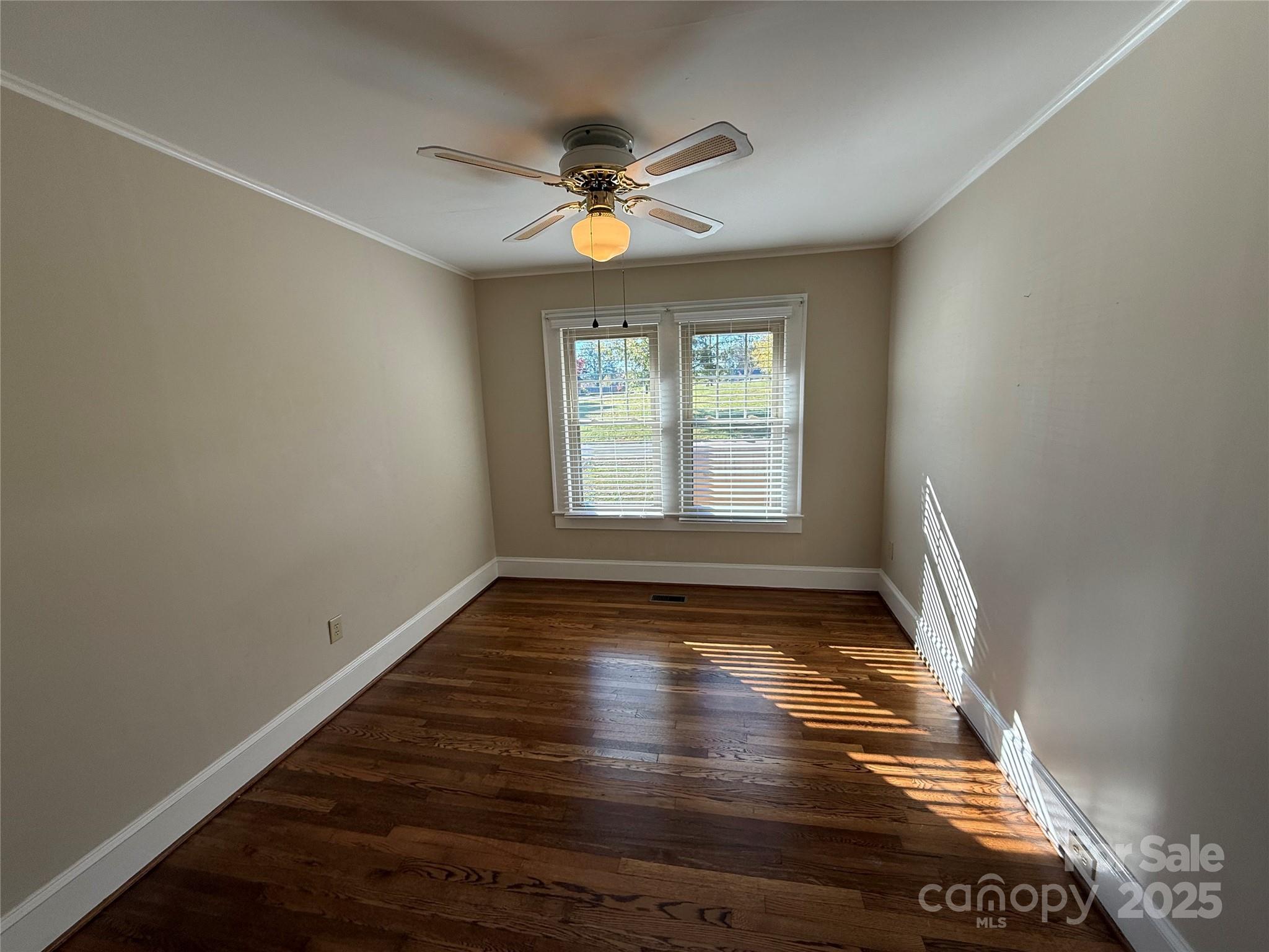 2550 Lail Road Glen Alpine, NC 28655 - Photo 16 of 35 a view of empty room with wooden floor and fan