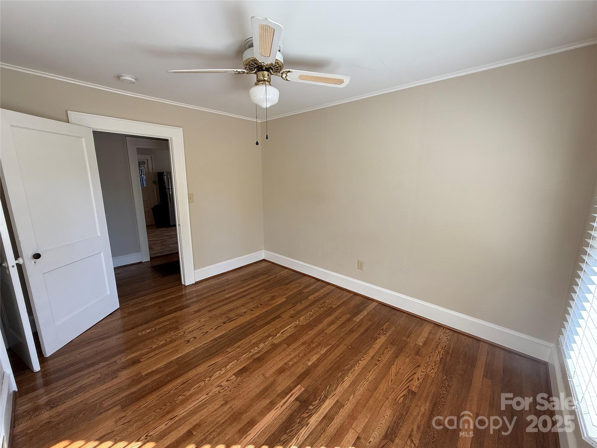 2550 Lail Road Glen Alpine, NC 28655 - Photo 17 of 35 a view of an empty room with wooden floor