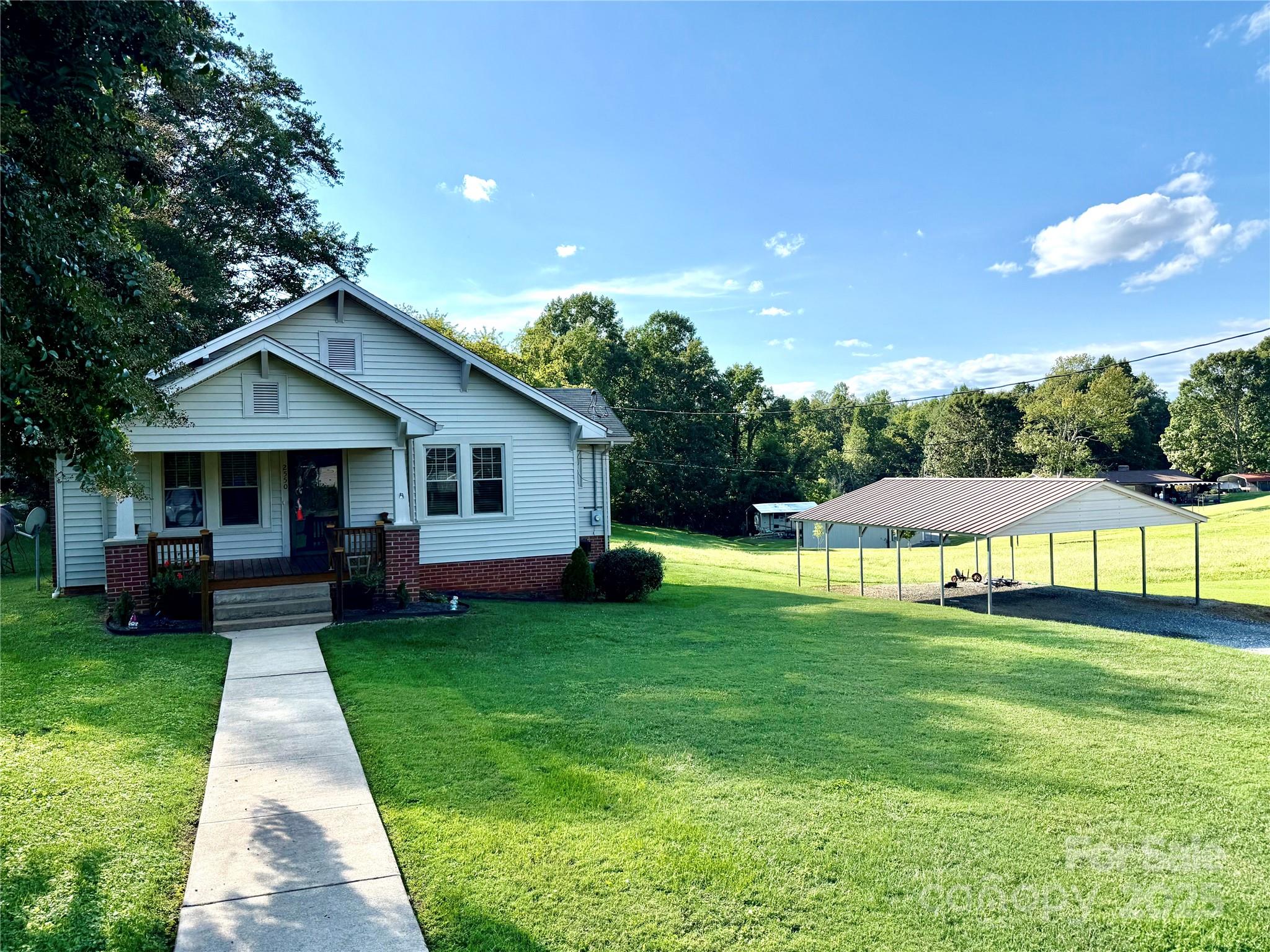 2550 Lail Road Glen Alpine, NC 28655 - Photo 22 of 35 a view of a house with a yard porch and sitting area