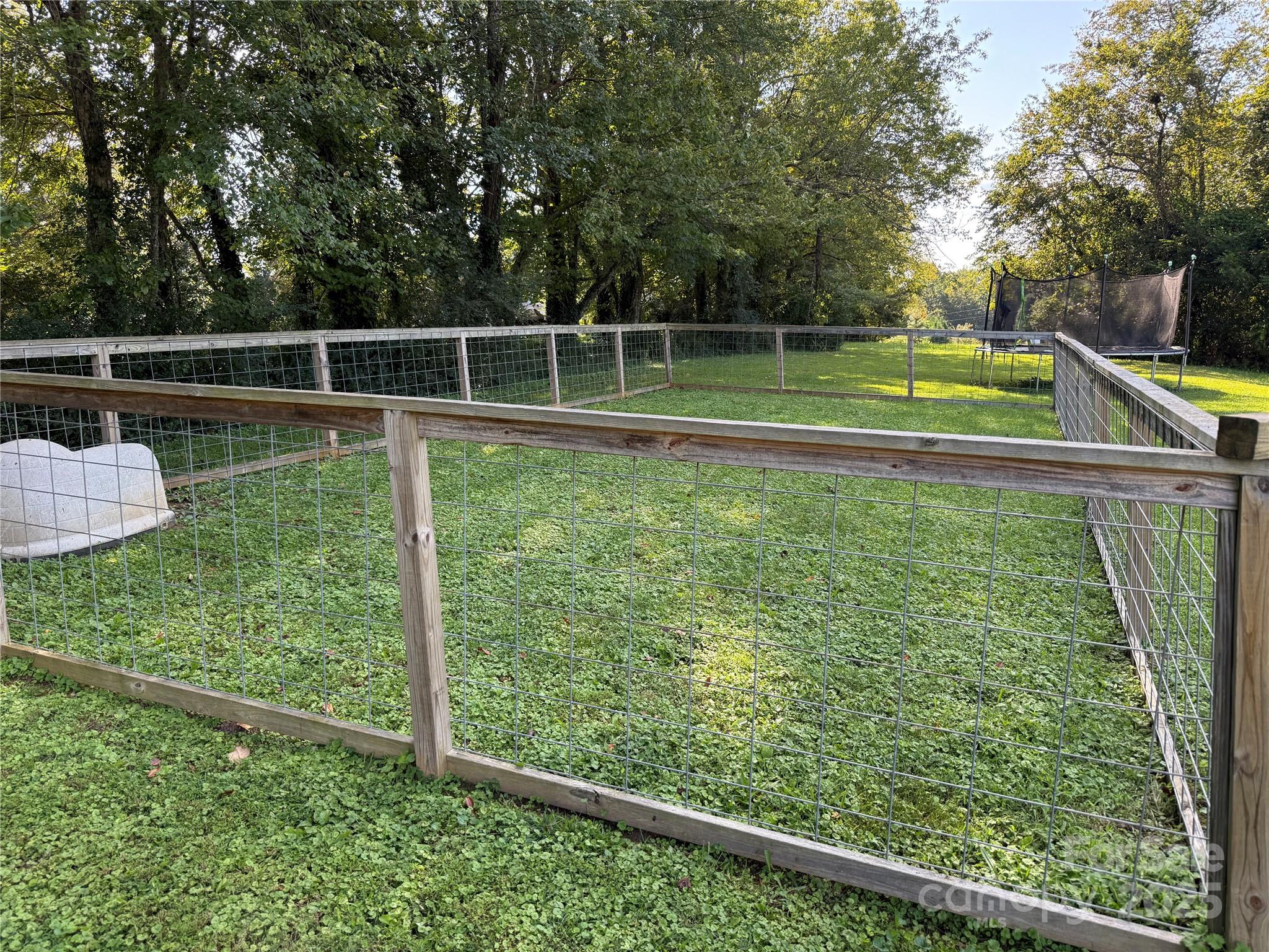 2550 Lail Road Glen Alpine, NC 28655 - Photo 25 of 35 a view of a yard with a wooden fence