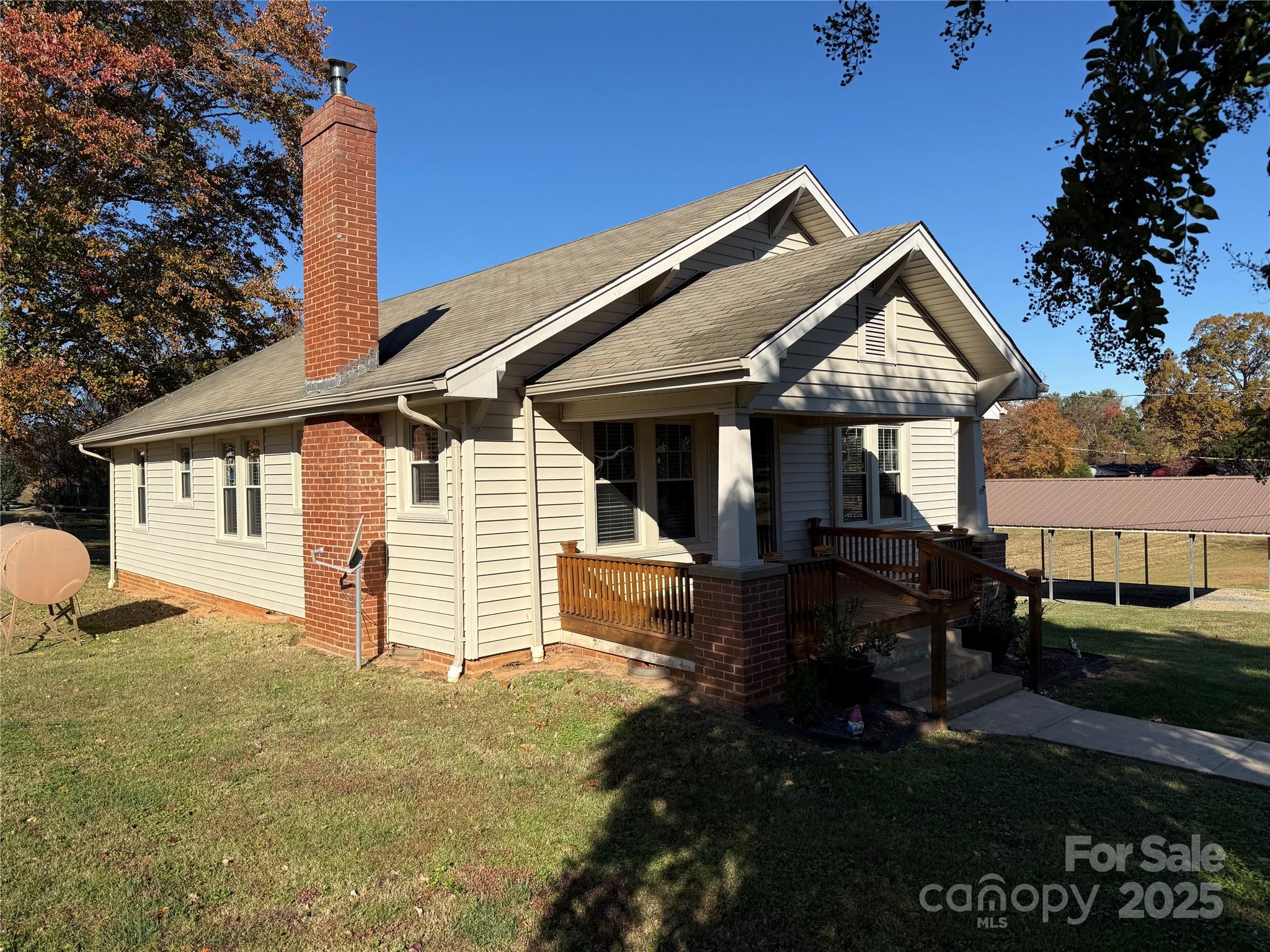 2550 Lail Road Glen Alpine, NC 28655 - Photo 32 of 35 a front view of a house with garden