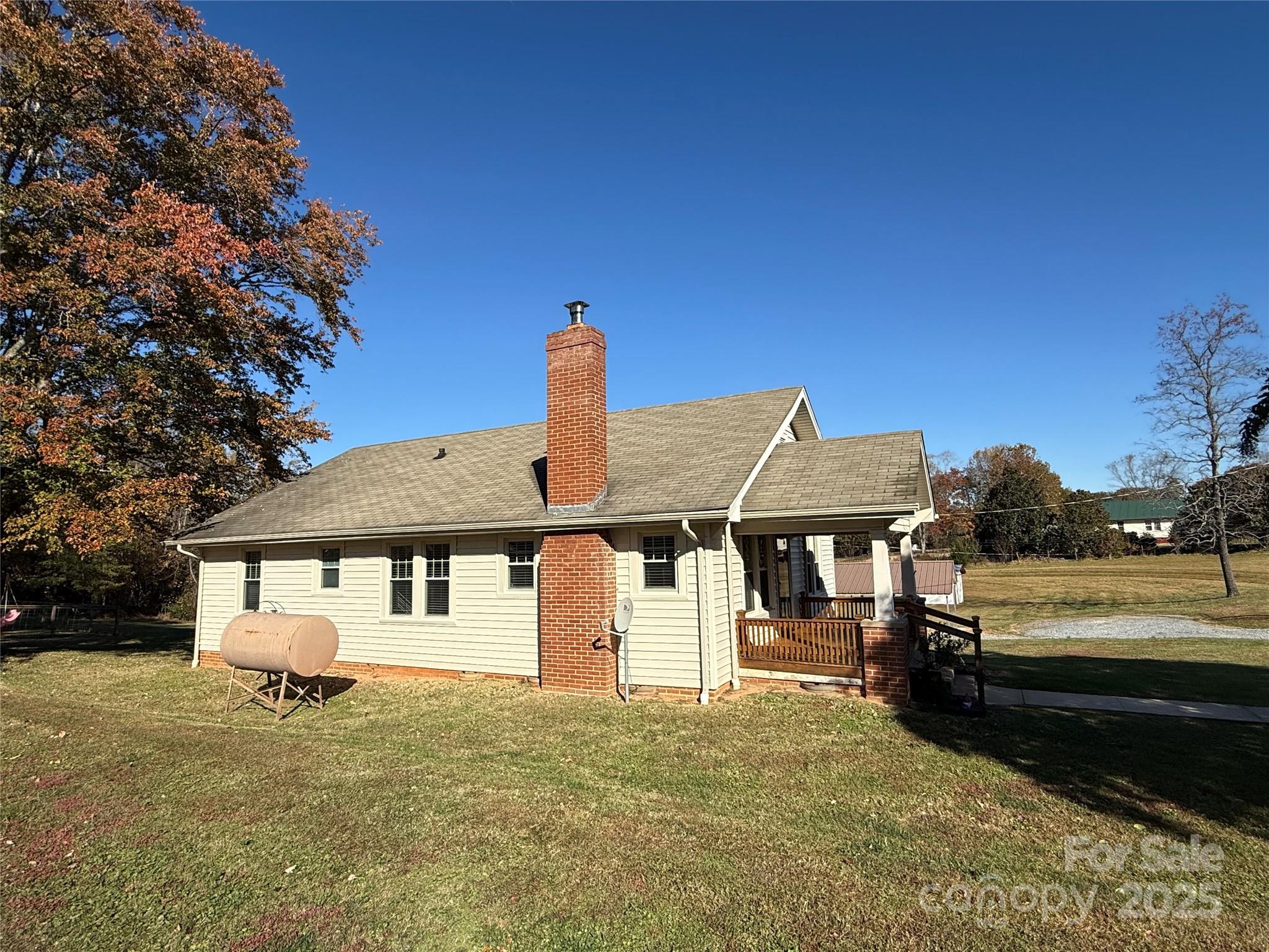 2550 Lail Road Glen Alpine, NC 28655 - Photo 33 of 35 a front view of a house with a garden