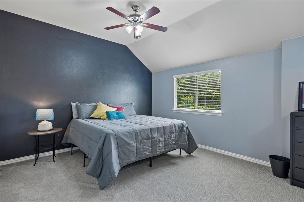 8104 Red Riv Run North Richland Hills, TX 76180 - Photo 27 of 38 a bedroom with a bed and a window