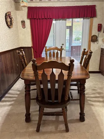 a view of a dining room with furniture and window
