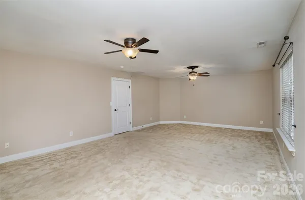 a view of a big room with carpet