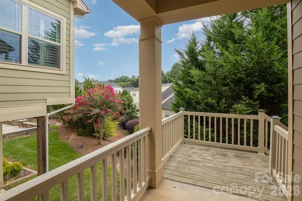 a view of a balcony with wooden floor