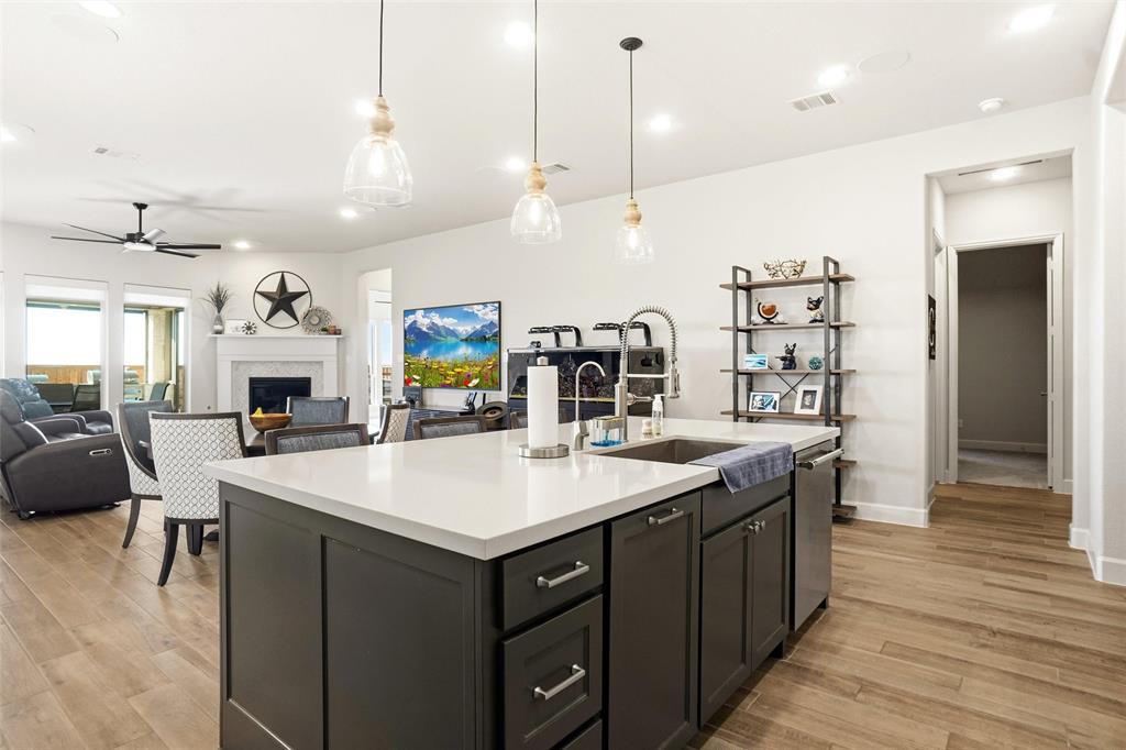 118 Alamito Road Rhome, TX 76078 - Photo 13 of 37 a large kitchen with a table and chairs