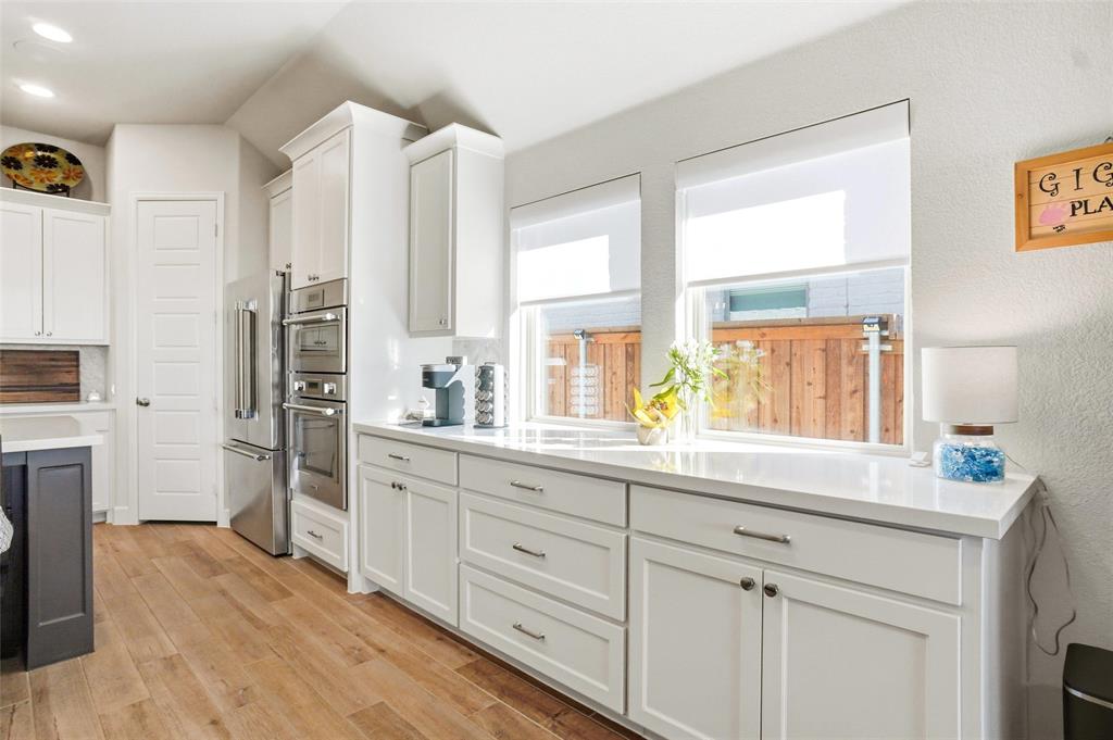 118 Alamito Road Rhome, TX 76078 - Photo 14 of 37 a kitchen with stainless steel appliances cabinets and a large window