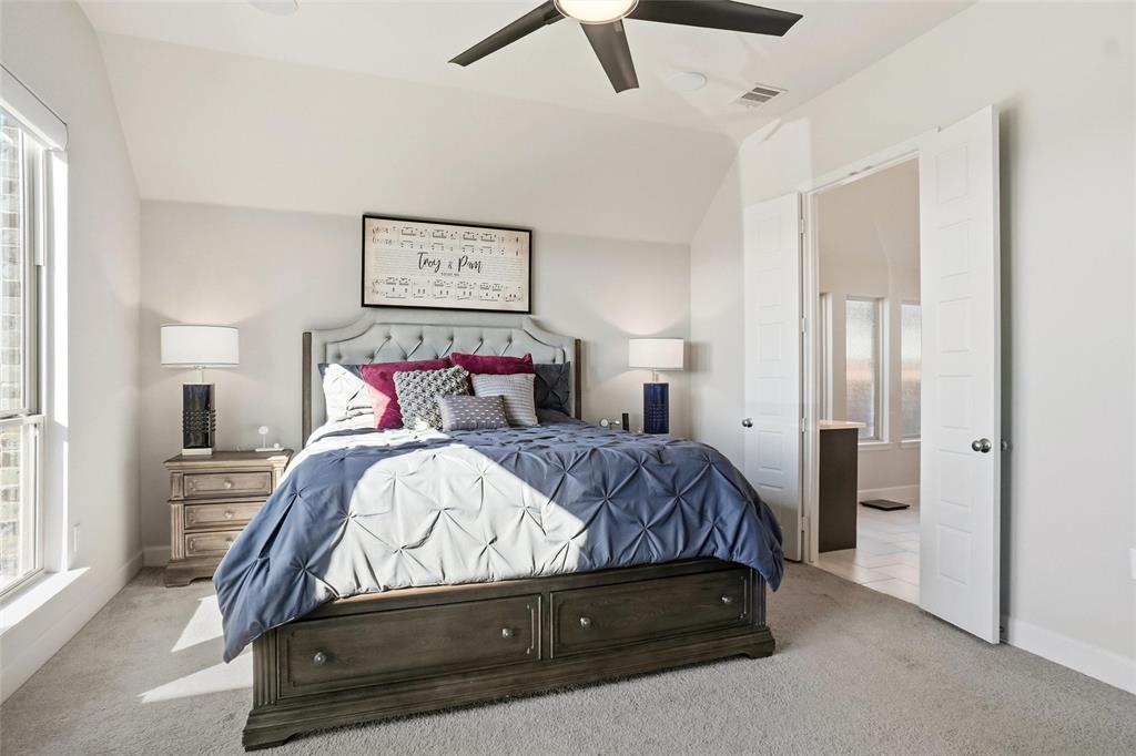 118 Alamito Road Rhome, TX 76078 - Photo 18 of 37 a bedroom with a bed and painting on the wall