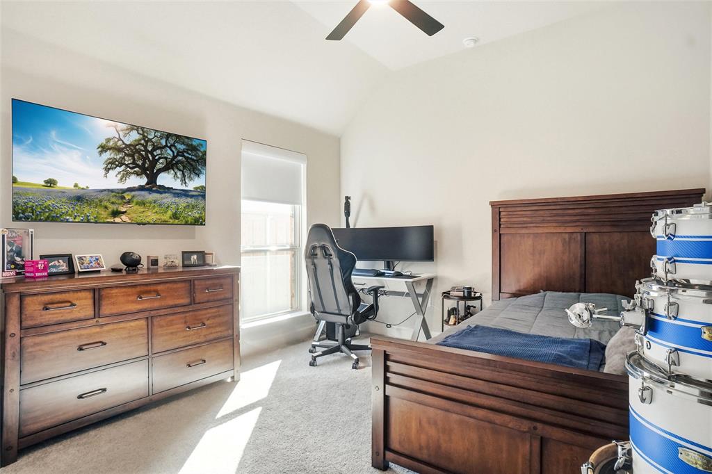118 Alamito Road Rhome, TX 76078 - Photo 24 of 37 a living room with furniture and a flat screen tv