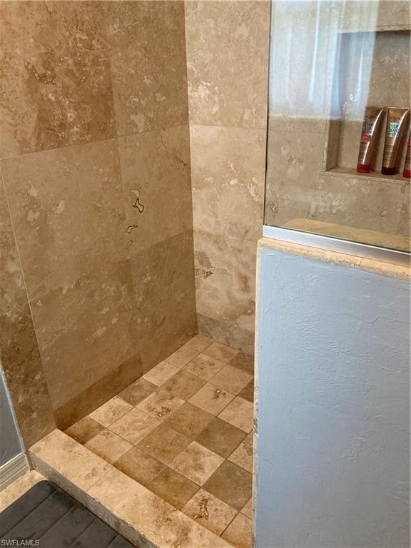 250 Pinehurst Circle Naples, FL 34113 - Photo 16 of 23 a bathroom with a shower