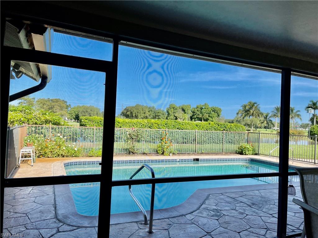 250 Pinehurst Circle Naples, FL 34113 - Photo 5 of 23 a view of a bench in front of building