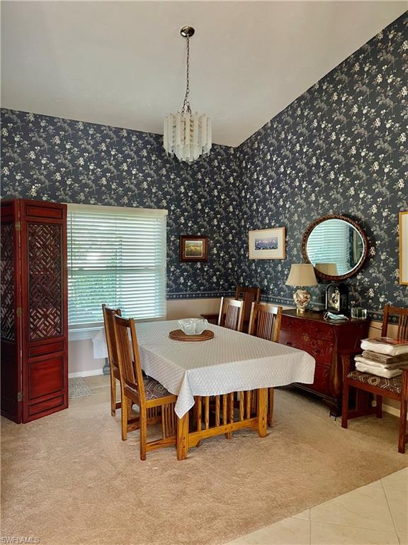 250 Pinehurst Circle Naples, FL 34113 - Photo 9 of 23 a table and chairs in a room