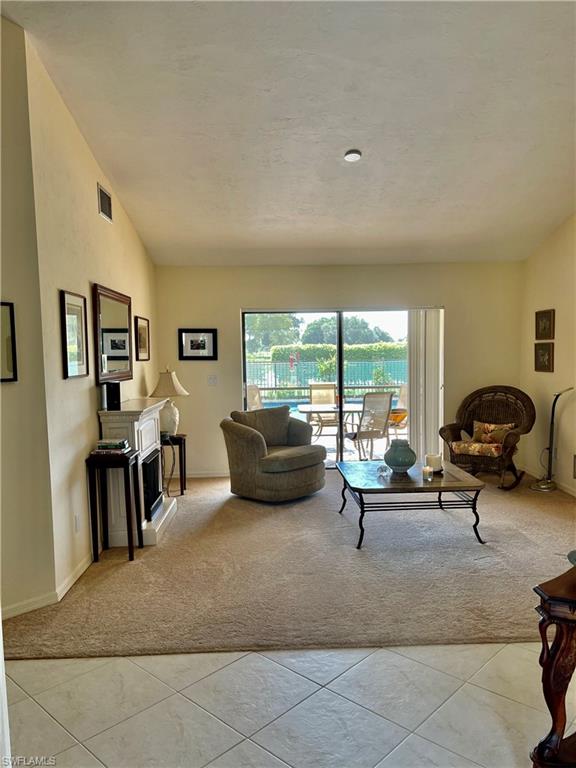 250 Pinehurst Circle Naples, FL 34113 - Photo 10 of 23 a living room with furniture and a large window