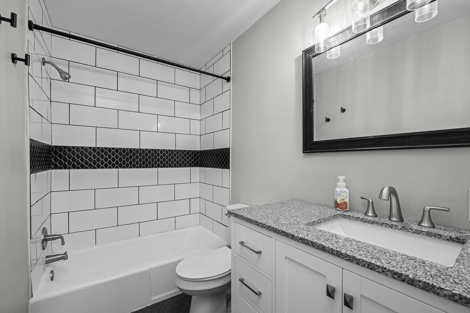 4315 26th Avenue Moline, IL 61265 - Photo 13 of 16 a bathroom with a granite countertop bathtub sink vanity mirror and toilet