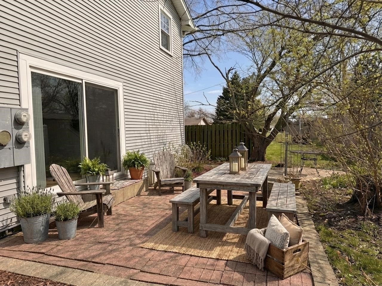 4315 26th Avenue Moline, IL 61265 - Photo 15 of 16 a view of a patio with table and chairs and potted plants