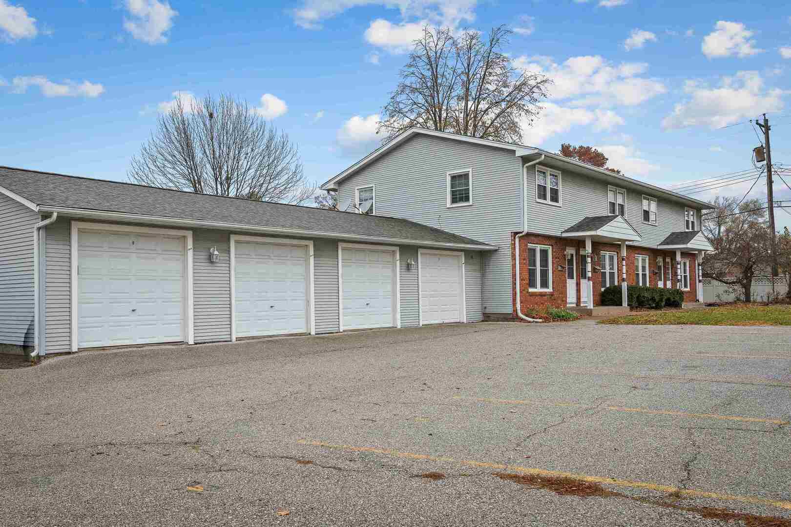 4315 26th Avenue Moline, IL 61265 - Photo 16 of 16 a front view of a house with a yard and garage