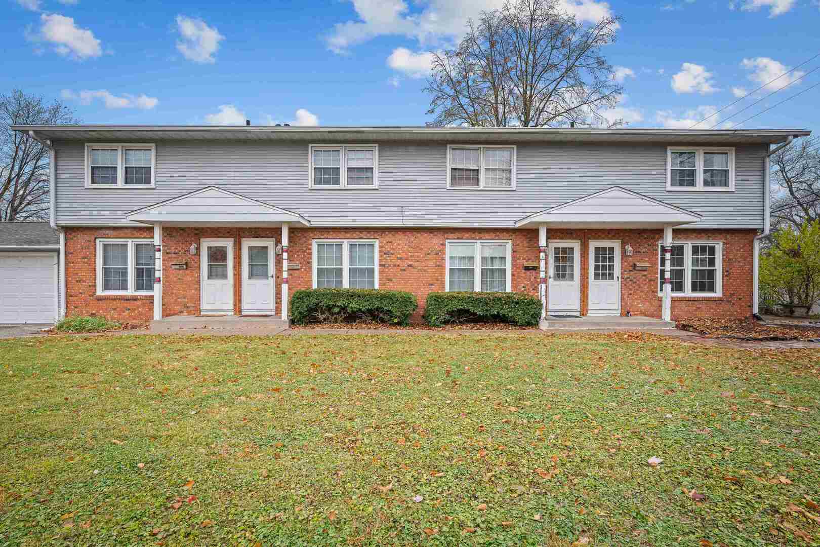 4315 26th Avenue Moline, IL 61265 - Photo 2 of 16 a front view of a house with a garden