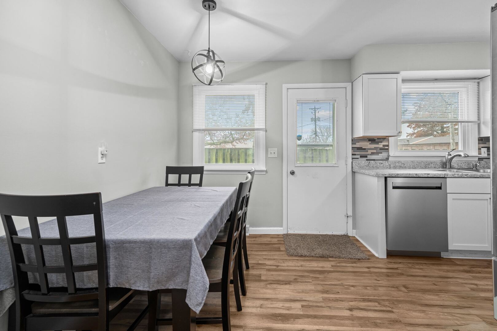 4315 26th Avenue Moline, IL 61265 - Photo 6 of 16 a view of a dining room with furniture window and wooden floor