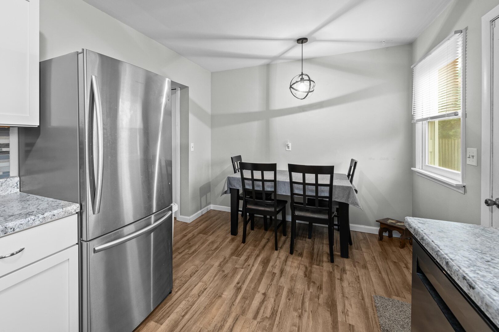 4315 26th Avenue Moline, IL 61265 - Photo 10 of 16 a view of a dining room with furniture window and wooden floor
