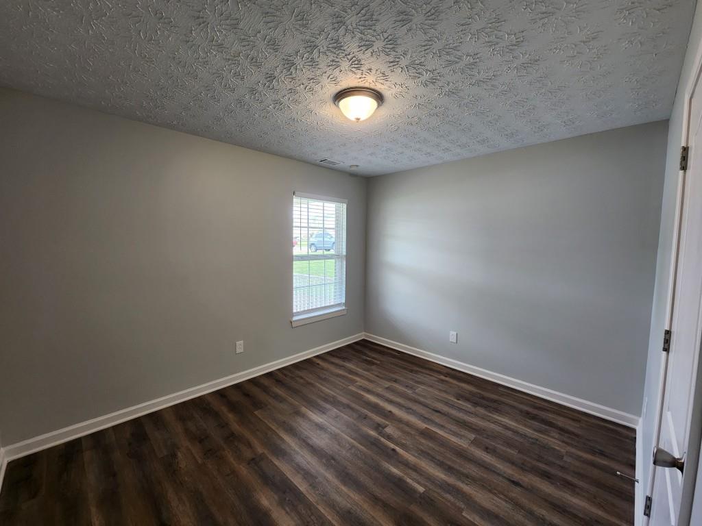 504 Dove Way Social Circle, GA 30025 - Photo 14 of 16 a view of an empty room with a window