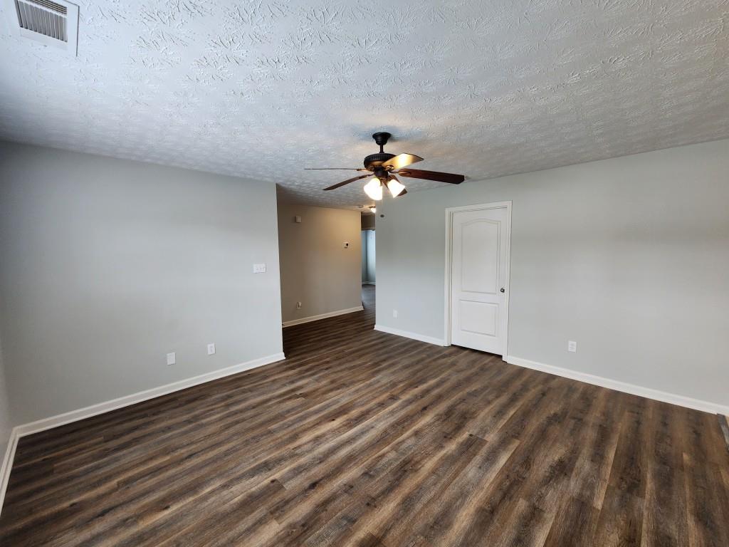 504 Dove Way Social Circle, GA 30025 - Photo 5 of 16 a view of empty room with wooden floor