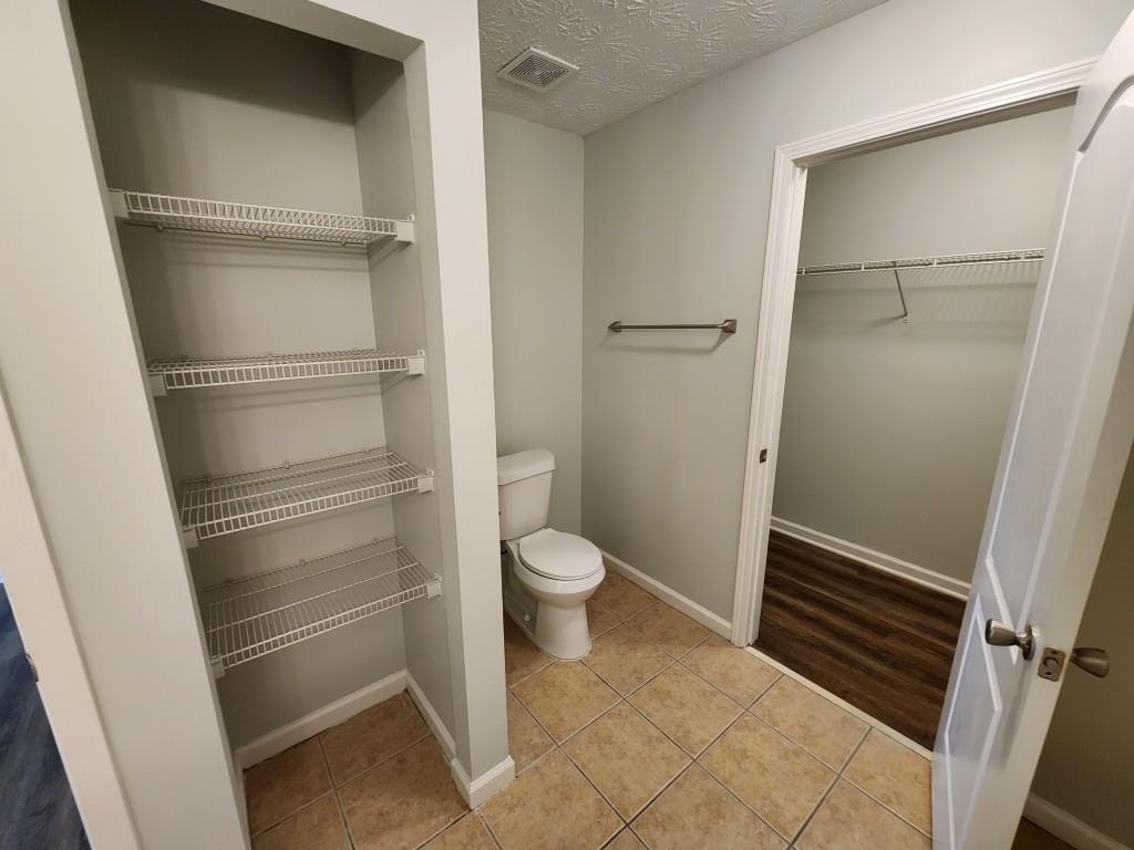 504 Dove Way Social Circle, GA 30025 - Photo 10 of 16 a bathroom with a toilet and a sink