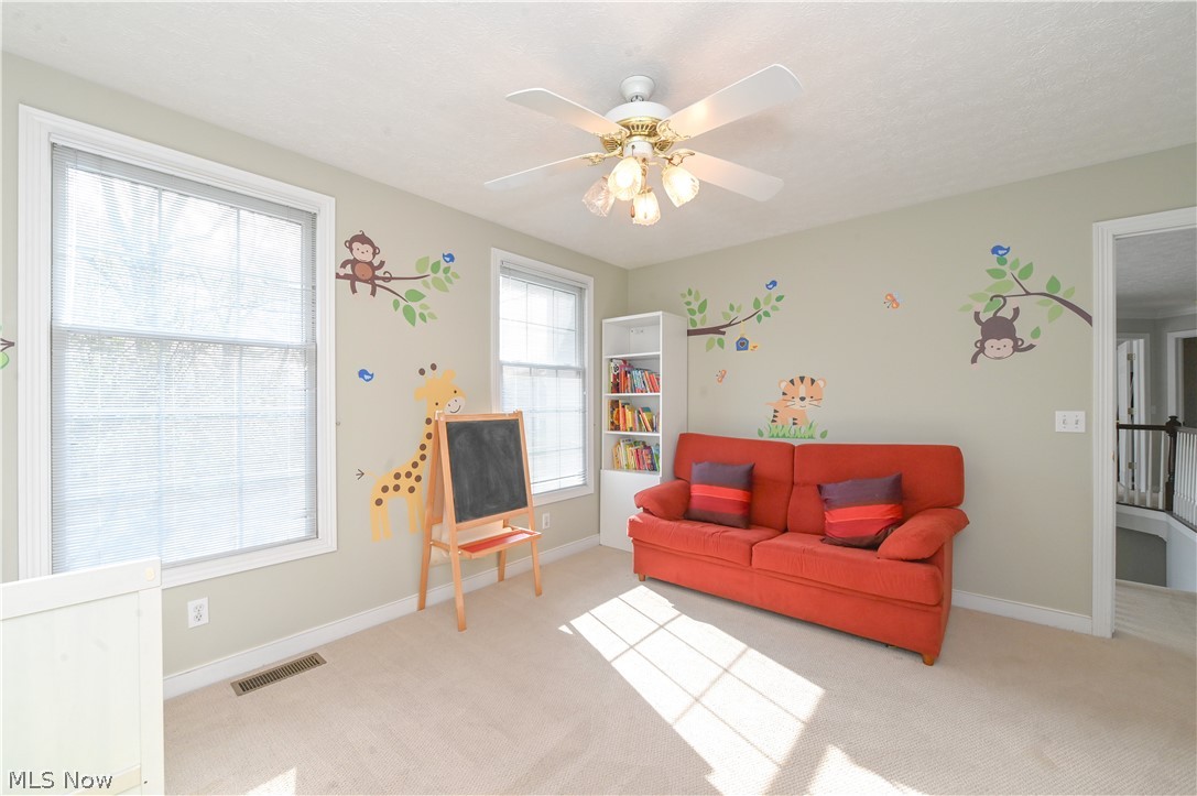 1688 Sheridan Road South Euclid, OH 44121 - Photo 26 of 48 Carpeted living room with ceiling fan