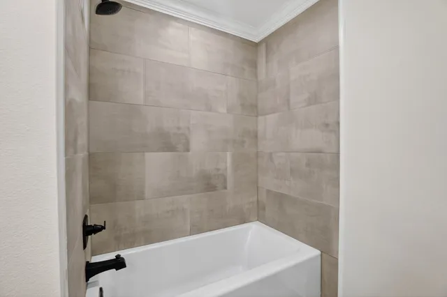 a kitchen with white cabinets and appliances
