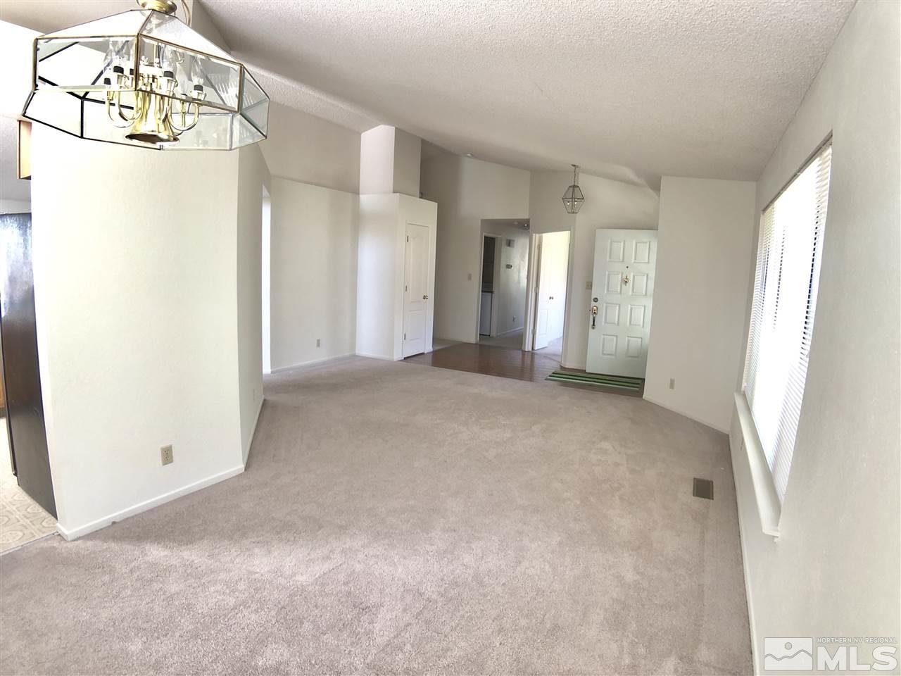 6364 Chesterfield Lane Reno, NV 89523 - Photo 14 of 29 a view of a big room with closet and chandelier