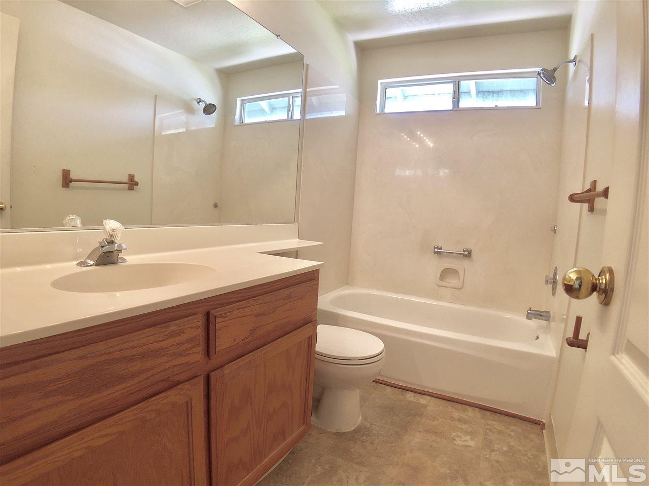 6364 Chesterfield Lane Reno, NV 89523 - Photo 19 of 29 a bathroom with a sink a toilet and bathtub