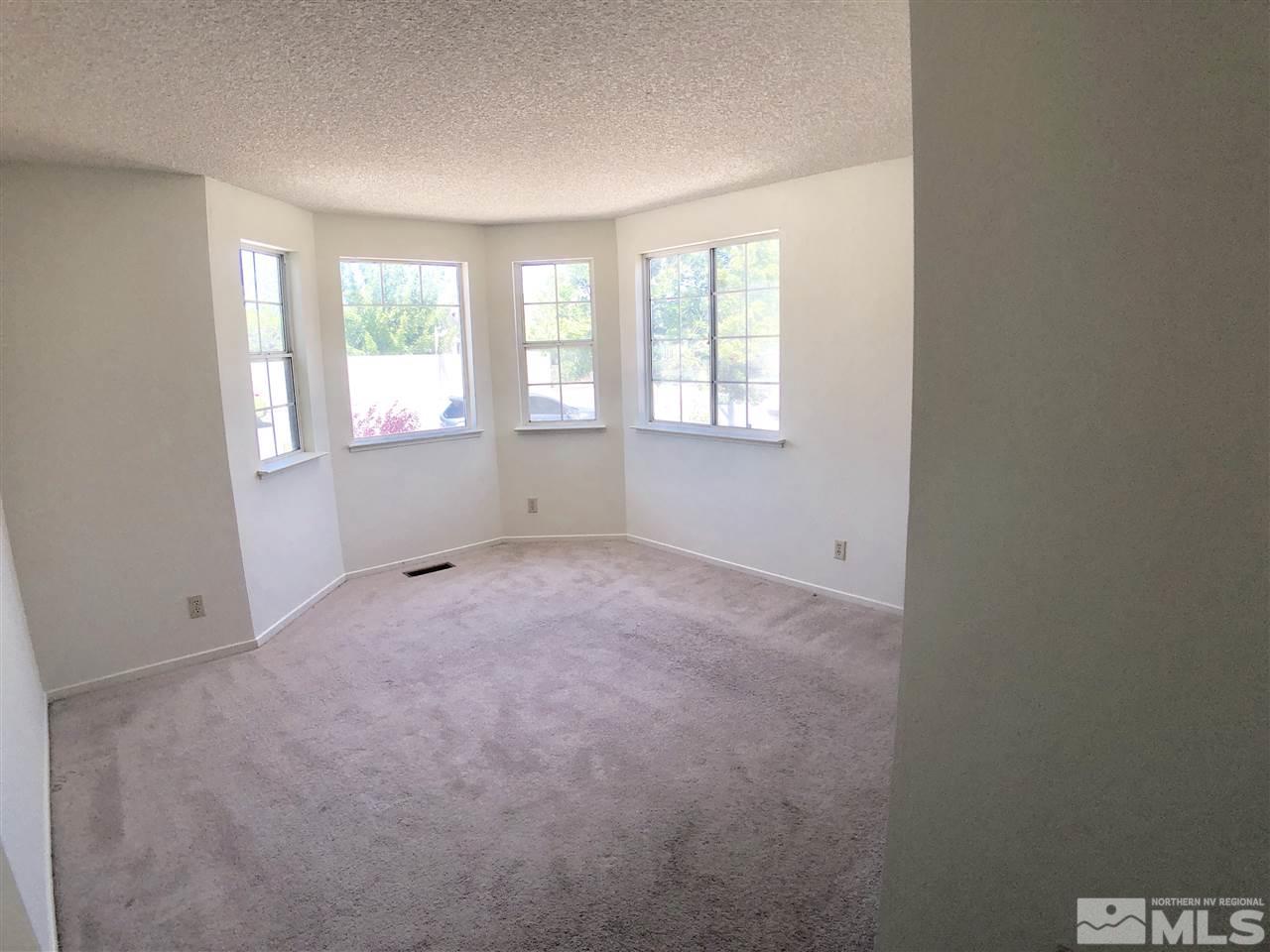 6364 Chesterfield Lane Reno, NV 89523 - Photo 20 of 29 an empty room with windows