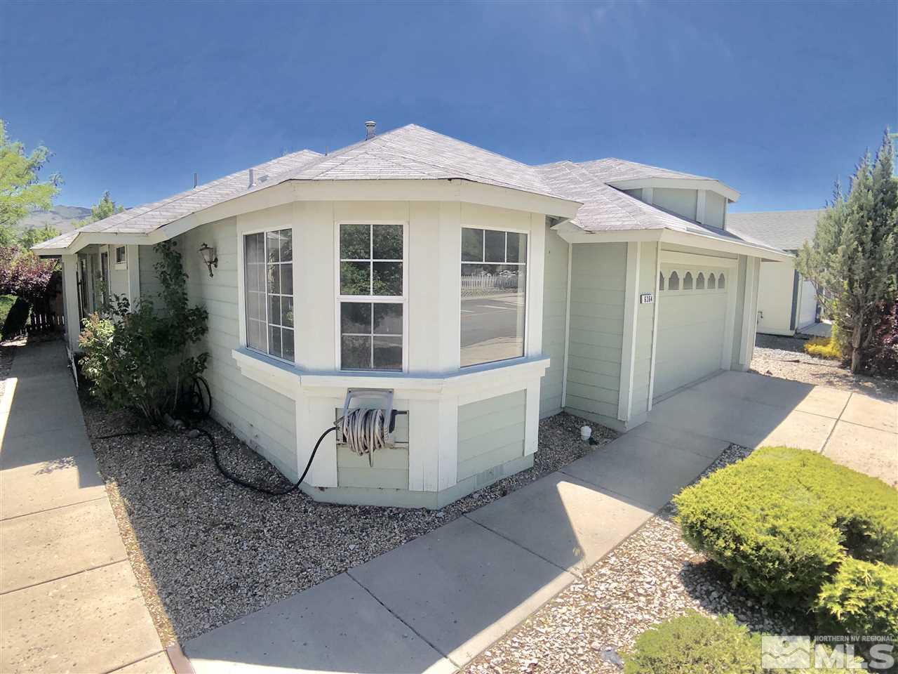 6364 Chesterfield Lane Reno, NV 89523 - Photo 2 of 29 a front view of a house with a garden