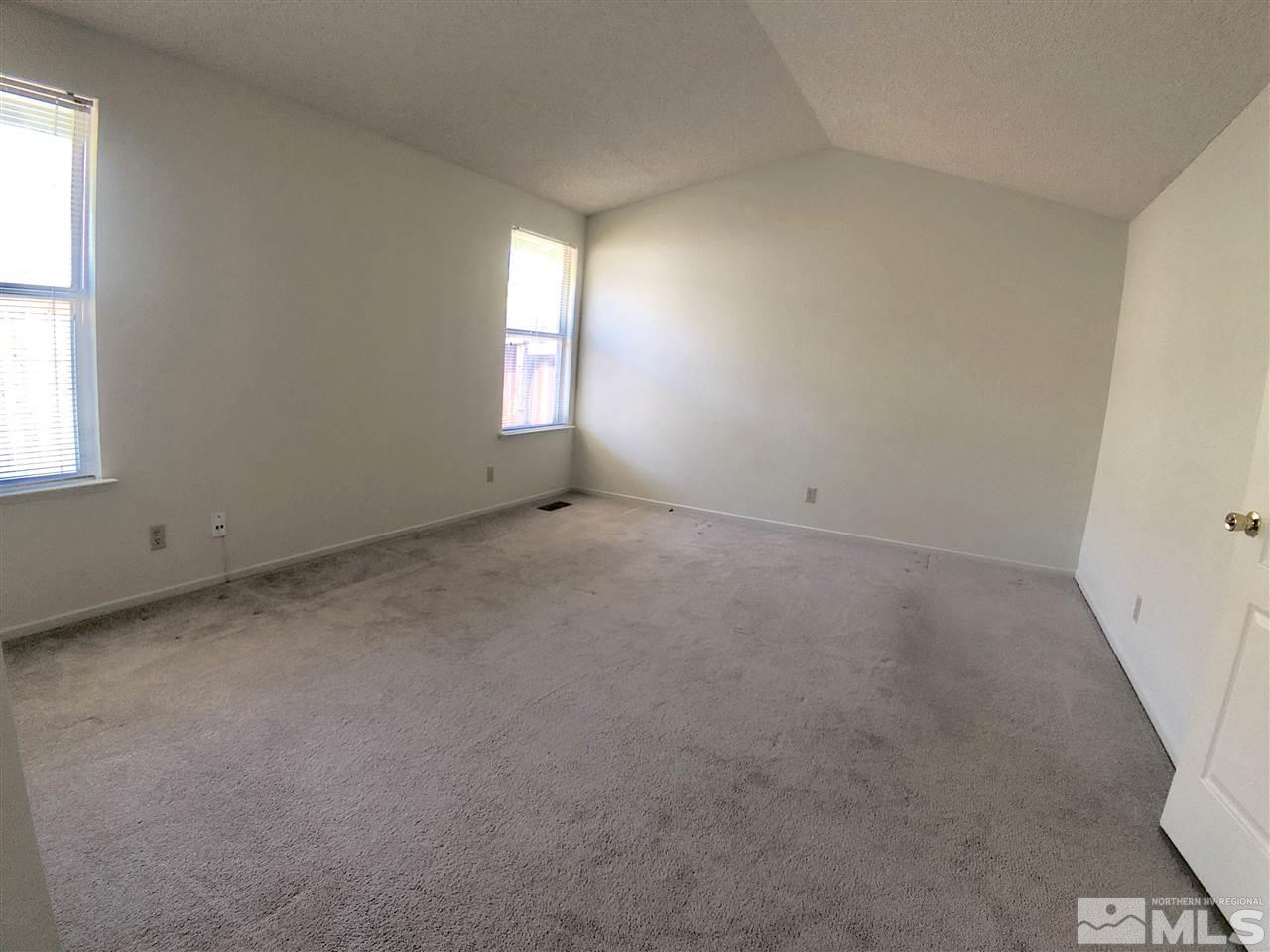 6364 Chesterfield Lane Reno, NV 89523 - Photo 22 of 29 an empty room with windows