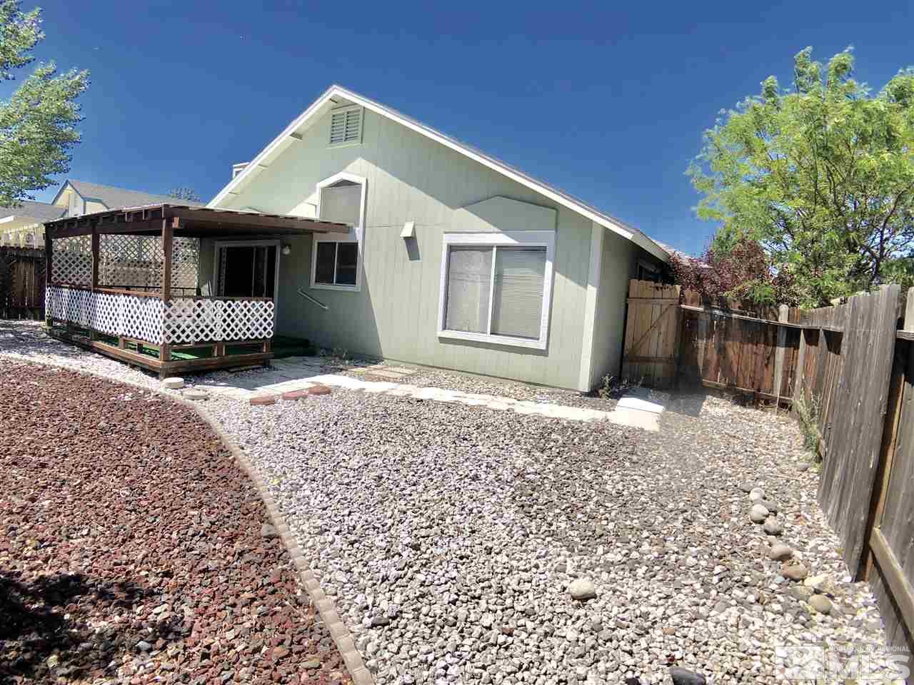6364 Chesterfield Lane Reno, NV 89523 - Photo 27 of 29 a front view of a house with a yard
