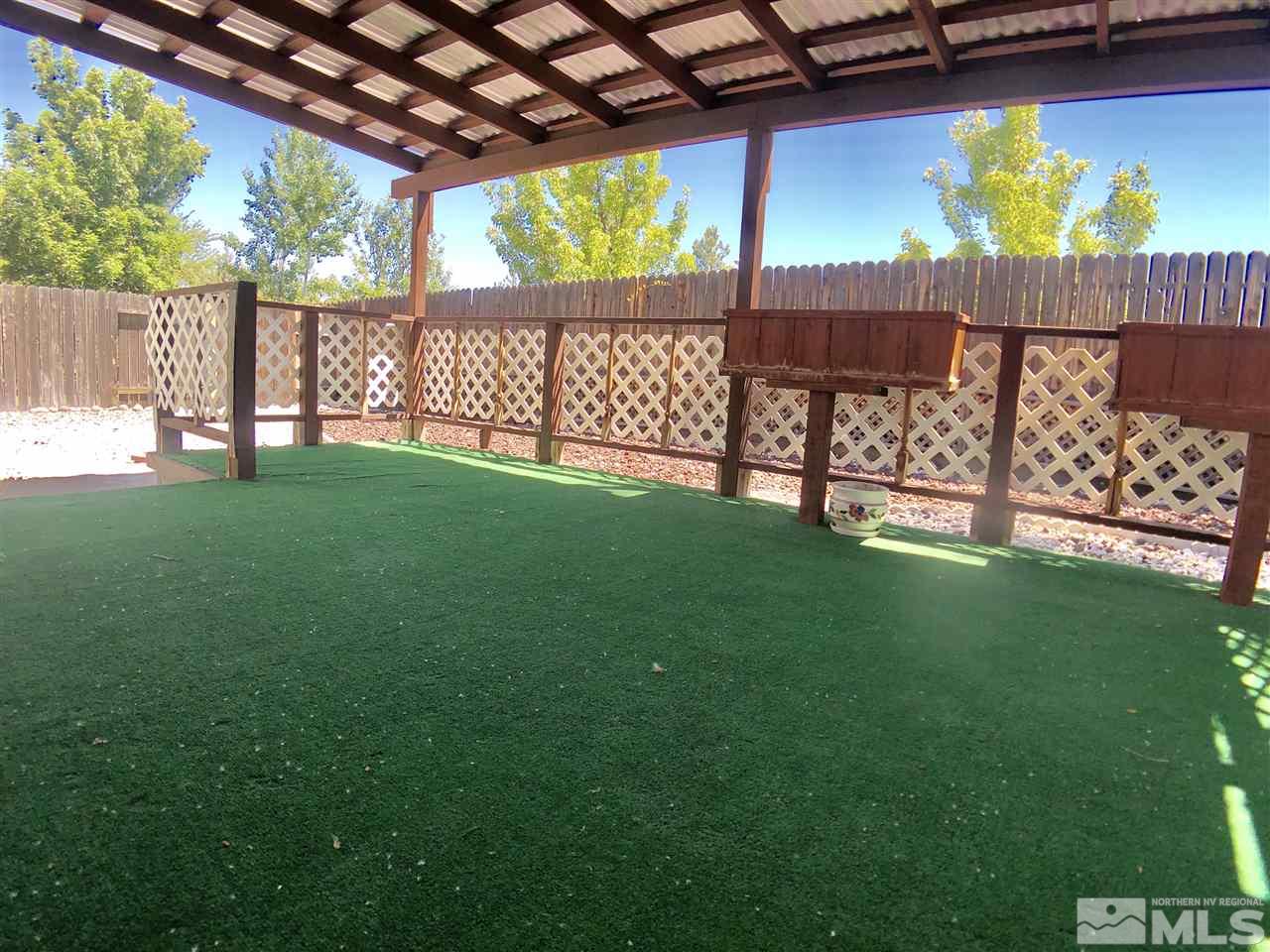 6364 Chesterfield Lane Reno, NV 89523 - Photo 28 of 29 a view of a backyard with a garden and deck