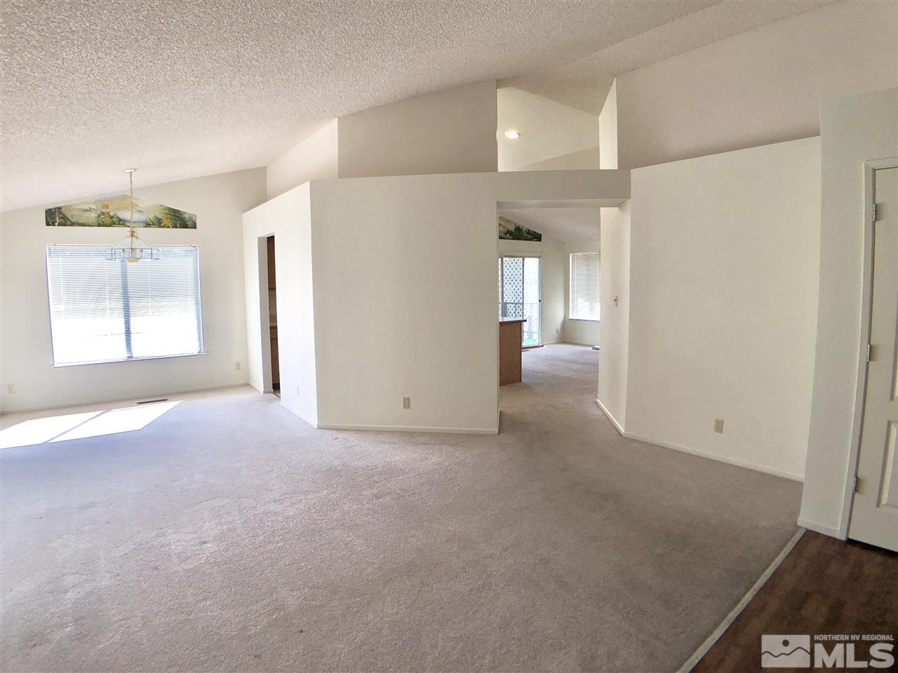 6364 Chesterfield Lane Reno, NV 89523 - Photo 6 of 29 an empty room with windows and closet