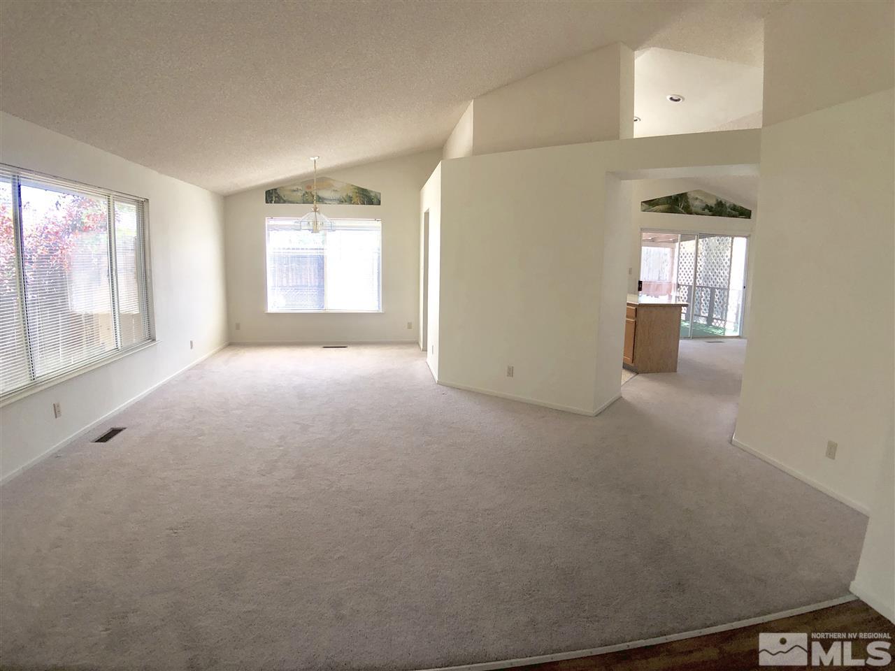 6364 Chesterfield Lane Reno, NV 89523 - Photo 7 of 29 an empty room with windows