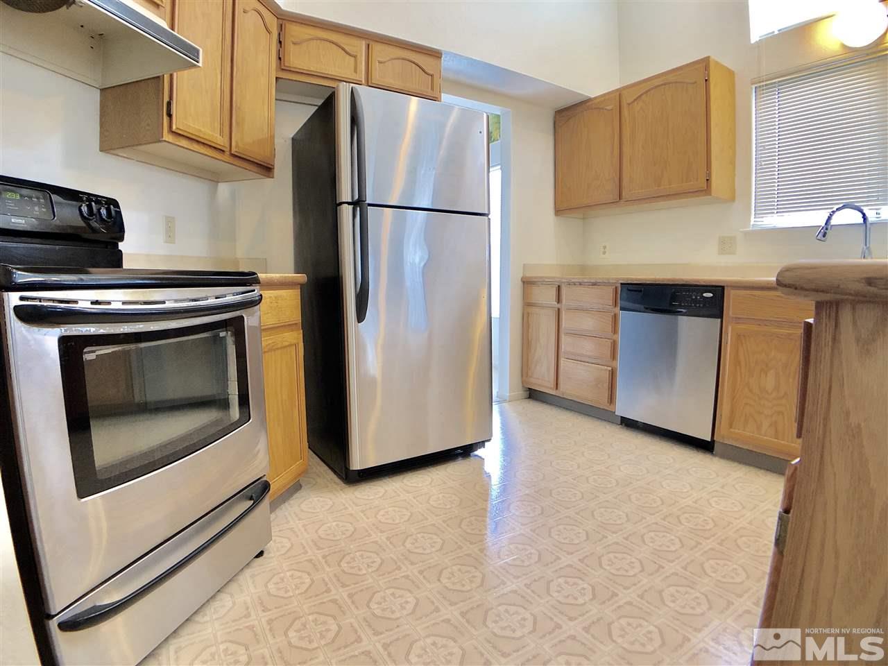 6364 Chesterfield Lane Reno, NV 89523 - Photo 9 of 29 a kitchen with cabinets and stainless steel appliances