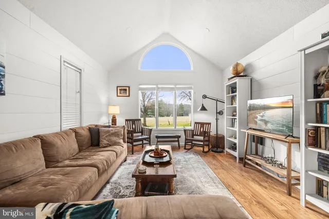 a living room with furniture fireplace and a flat screen tv